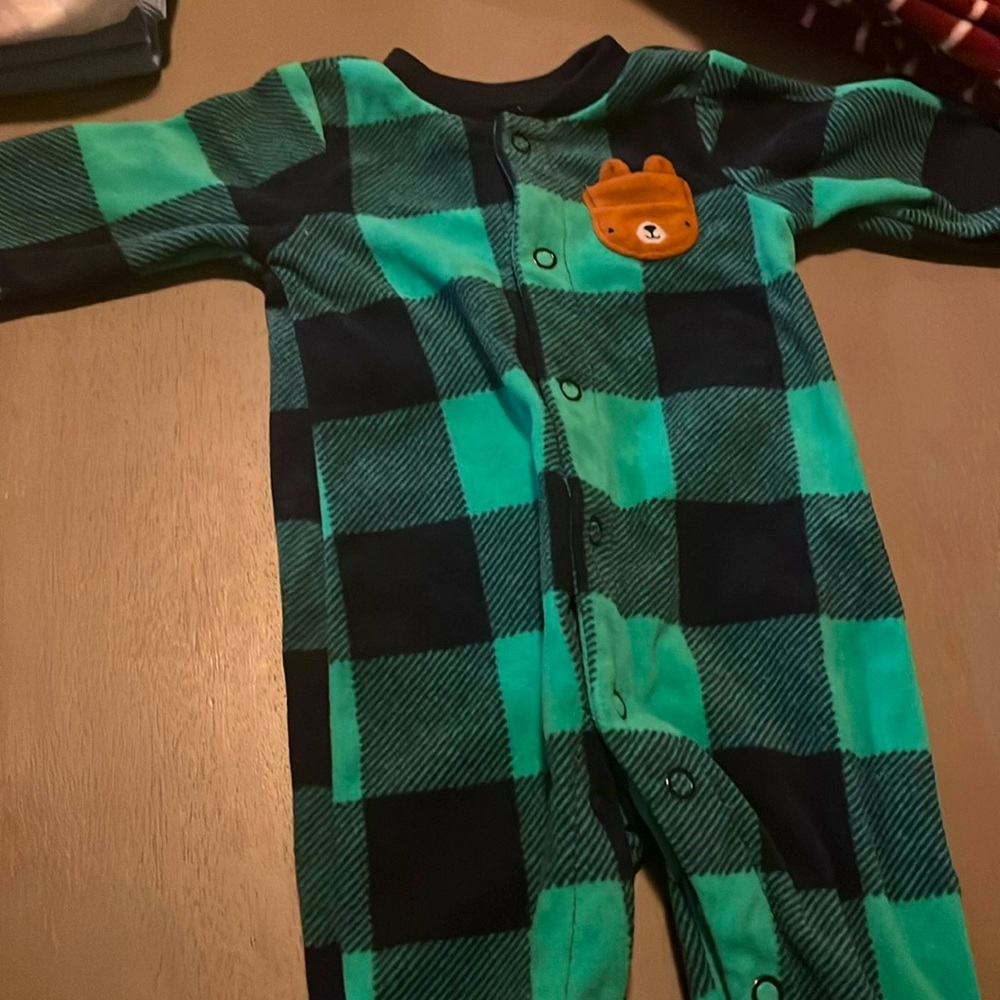 Green and black footies with little animal pocket, button up,newborn, worn once